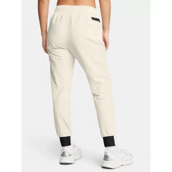  Ženske trenirke UNDER ARMOUR UA UNSTOPPABLE JOGGER 1376926-110 BELA 