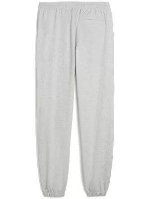 Moške trenirke PUMA M GRAPHIC FRENCH TERRY JOGGER 52770304 SVETLO SIVO VRESJE