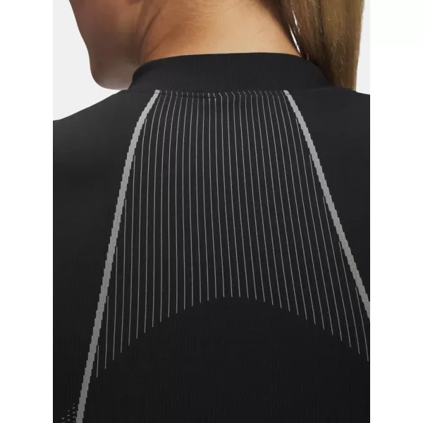  Ženska majica s kratkimi rokavi UNDER ARMOUR VANISH SEAMLESS LS 6000645-004 ČRNA 