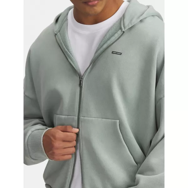  Moški pulover UNDER ARMOUR ICON HWT FLEECE WASH FZ 6000651-348 ZELENA 